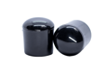 Side view of two black glossy LDPE straight-sided chair feet with a curved base.