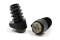 Side view of two round black plastic tube inserts with angled felted bases designed to prevent floor scratches.