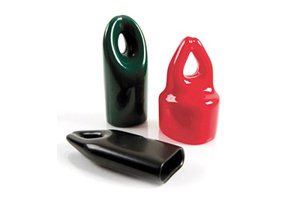Angled view of three flexible PVC dip moulded hanger caps in different colours and shapes—two upright and one lying on its side to show the open end.