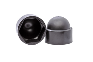 Side-by-side view of two domed, black, LDPE nut caps—one upright and one tilted to display the hexagonal open end.