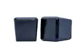 Side view of two black square LDPE injection moulded chair feet with a flat base.