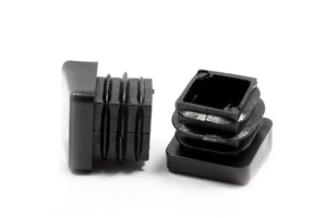 Side view of two square black plastic tube feet inserts with angled bases.