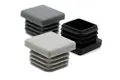 Angled view of three square plastic injection-moulded tube inserts: one black, one mid-grey, and one light grey.