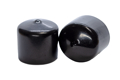Side-by-side view of two round, black, flexible non-phthalate dip moulded protective caps—one upright and one tilted to display the closed end surface.