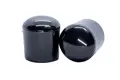 Side view of two black shiny LDPE straight-sided chair feet with a curved base.