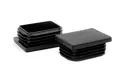 Angled view of two black rectangular LDPE tube inserts for table legs.