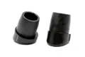 Side view of two round black plastic tube inserts with an angled base.