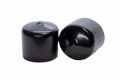 Side-by-side view of two round, black, flexible PVC dip moulded protective caps—one upright and one tilted to display the closed end surface.