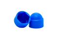 Side-by-side view of two domed, blue, plastic nut caps—one upright and one tilted to display the hexagonal open end.
