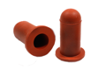 Side-by-side view of two round, rusty red, hi-temp silicone injection moulded washer caps—one upright and one tilted to display the open end.
