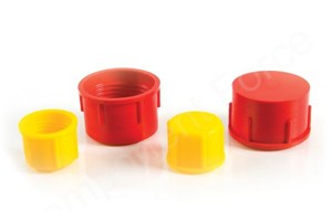 Angled view of four plastic threaded caps in red and yellow—two shown upright and two facing down.