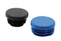 Angled view of two round plastic insert feet, injection moulded in black and blue.