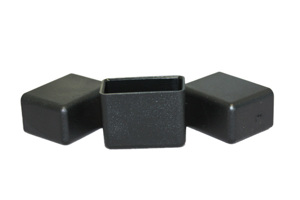 Side view of three matte black LDPE injection moulded rectangular chair feet with flat bases.