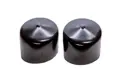 Side-by-side view of two face-down, round, black, flexible hi-temp vinyl dip moulded protective caps.