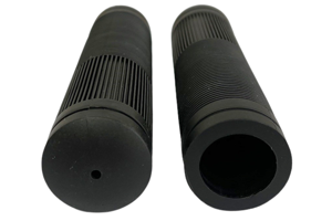 Angled front view of two black injection moulded ribbed rubber handle with fins. One showing the closed end, the other showing the open end.