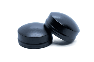 Angled front-top view of the cover sections of two black LDPE injection moulded secure nut and bolt cover caps.