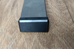 A rectangular metal leg with a black plastic LDPE foot mounted at the bottom.